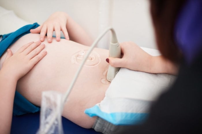 A child is receiving an ultrasound scan