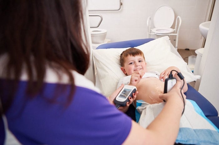 A child is receiving an ultrasound scan