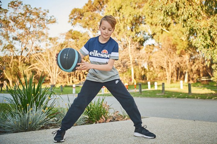 A boy playing basketball