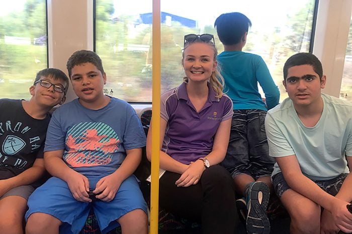 therapist and four boys on a train