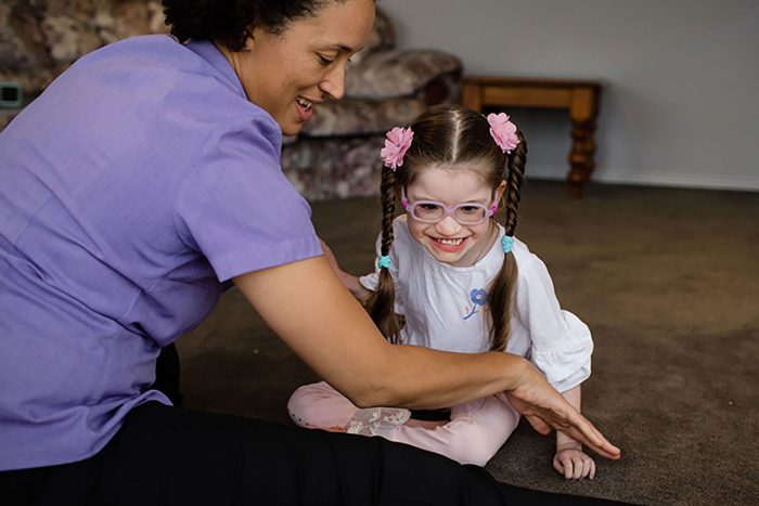 Physiotherapist with little girl