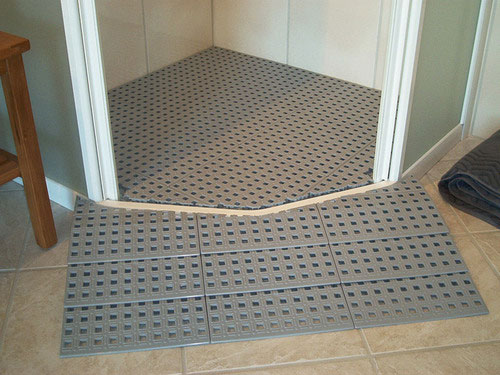 raised shower platform in shower cubicle