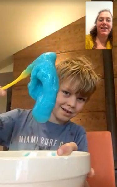 A screenshot of a boy playing with slime during a teletherapy session with his therapist