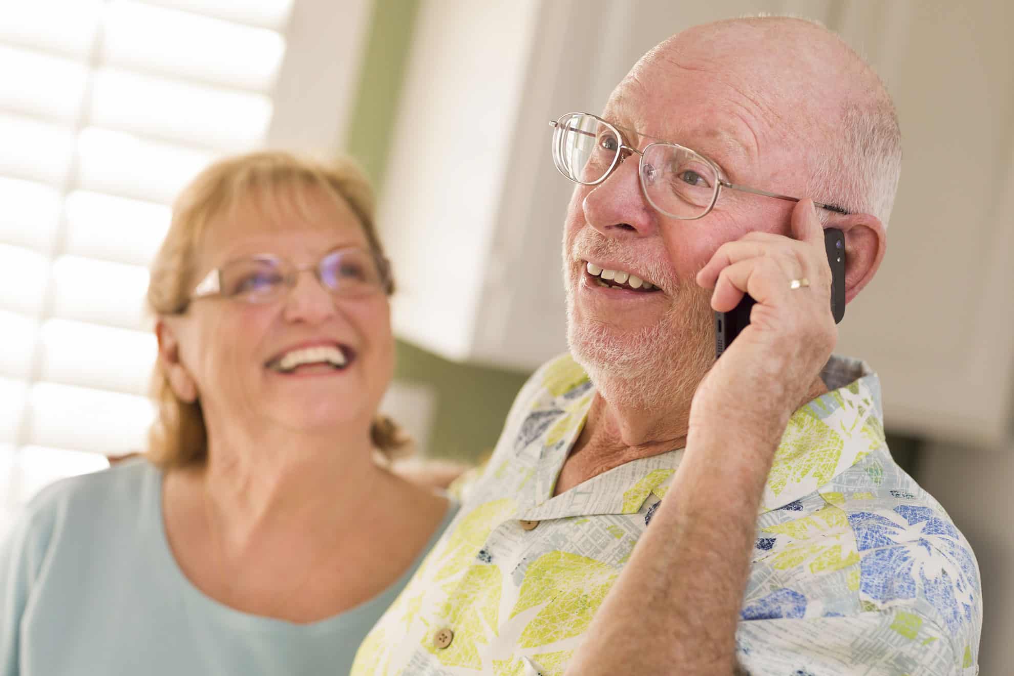 An elderly man on the phone to a continence clinician