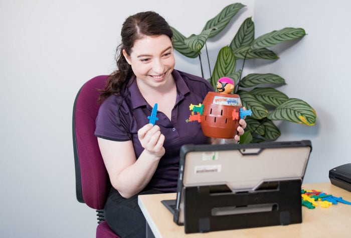 Therapist on a teletherapy session on a tablet device