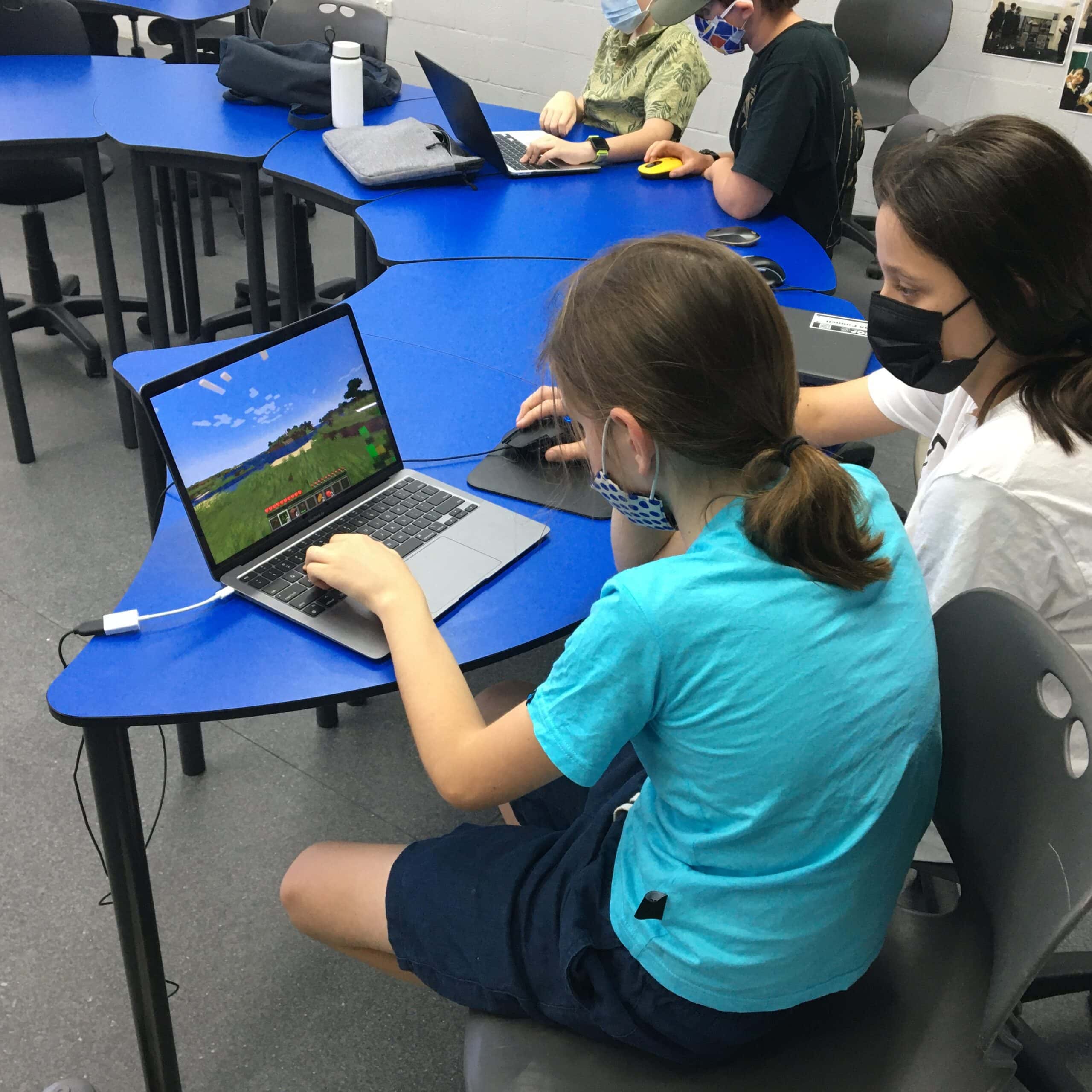 Students collaborate as they play Minecraft