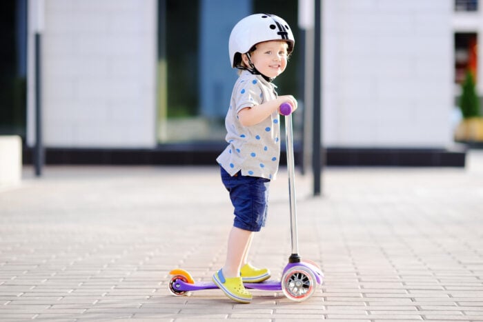 A toddler on a scooter