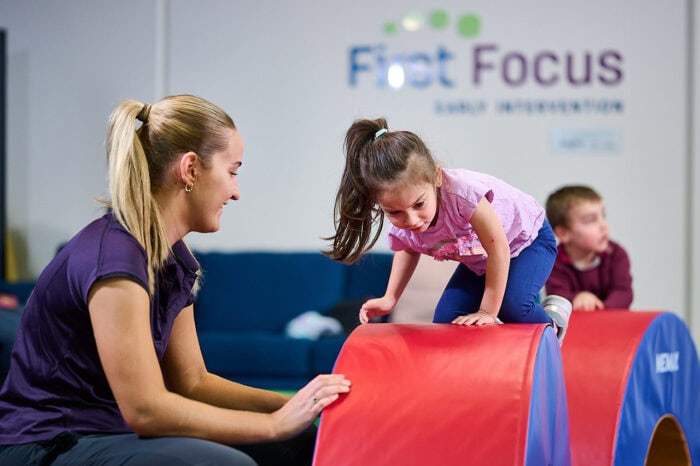 First Focus - girl on play equipment