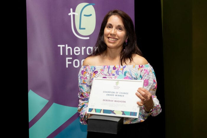 Deborah Waghorn holding her award 