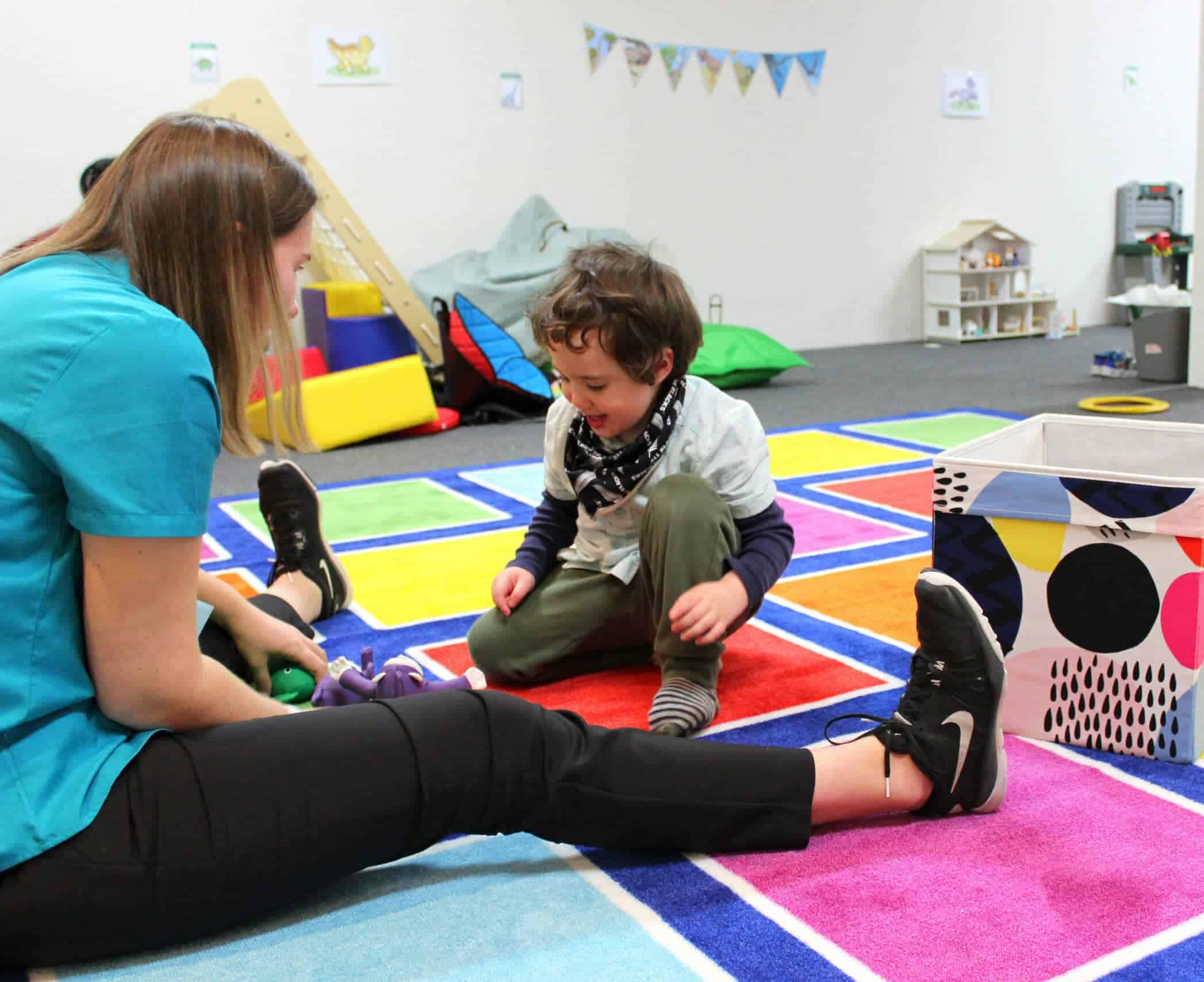 Therapists playing with a boy