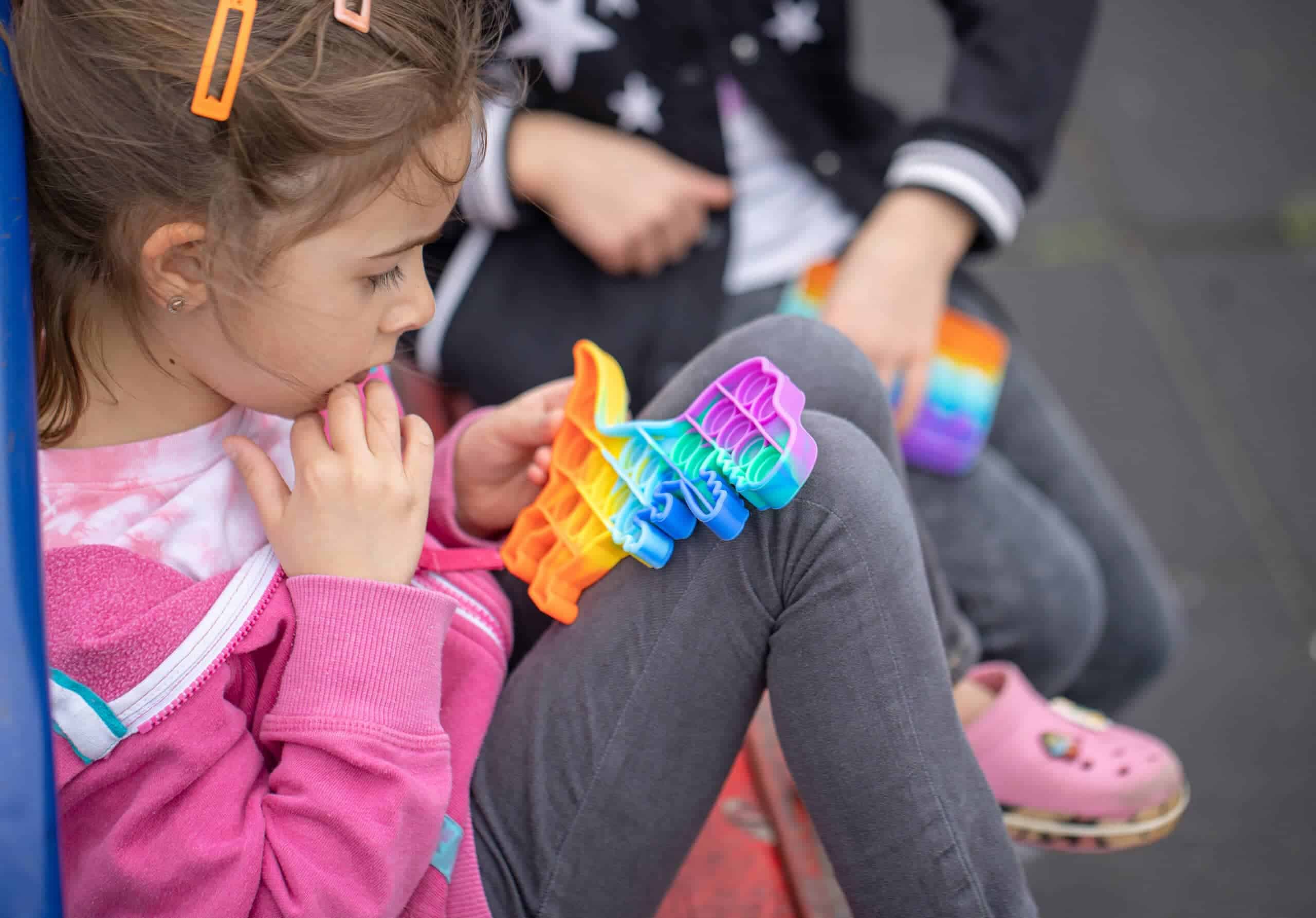 Young girl with sensory toy